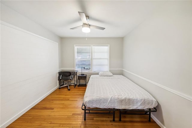 bedroom featuring ceiling fan and wood-type flooring