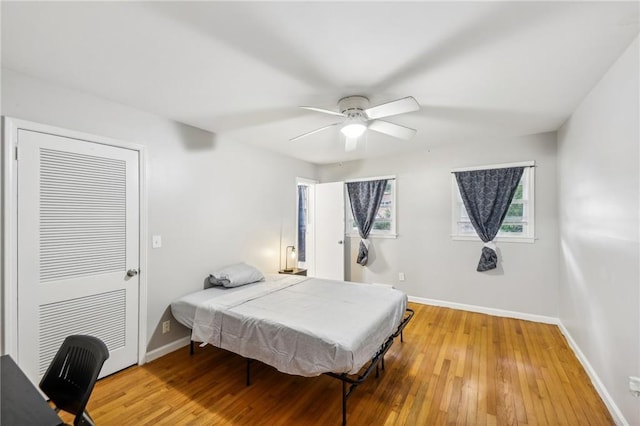 bedroom featuring wood-type flooring and ceiling fan