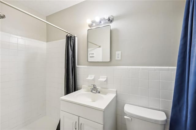 bathroom with vanity, a shower with curtain, toilet, and tile walls