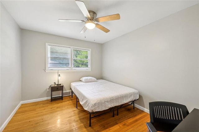 bedroom featuring light hardwood / wood-style floors and ceiling fan