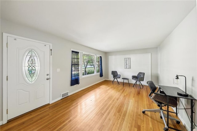 entryway with light hardwood / wood-style flooring