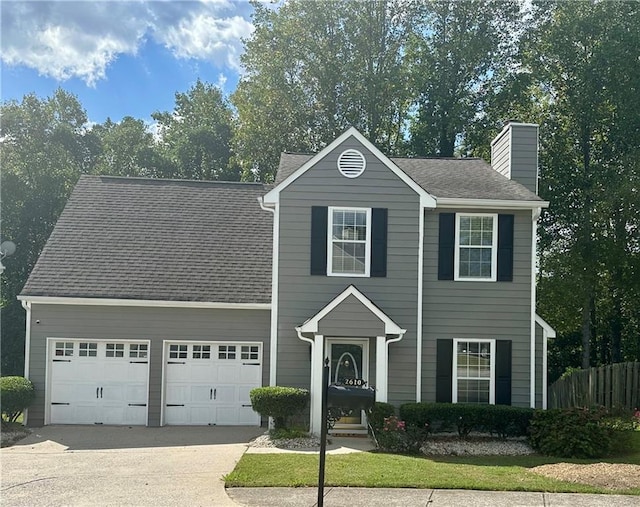 colonial house featuring a garage