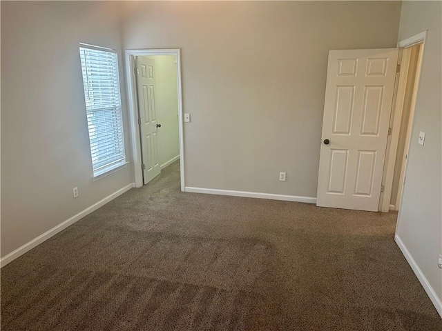 empty room with dark carpet