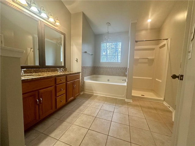 bathroom featuring tile patterned flooring, shower with separate bathtub, a chandelier, and vanity