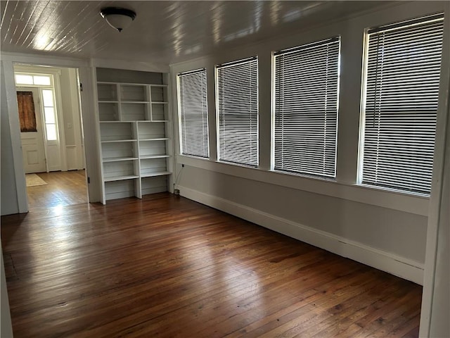 216 Hardee St, Dallas, GA 30132 - empty room featuring hardwood / wood-style floors, baseboards, and built in shelves
