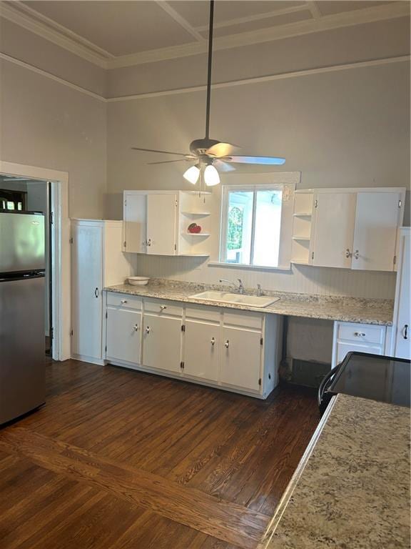216 Hardee St, Dallas, GA 30132 - kitchen with freestanding refrigerator, open shelves, white cabinetry, a sink, and a ceiling fan