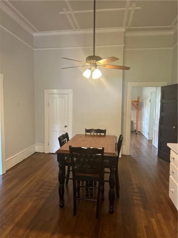 216 Hardee St, Dallas, GA 30132 - dining space featuring dark wood-style flooring, crown molding, a ceiling fan, a towering ceiling, and baseboards