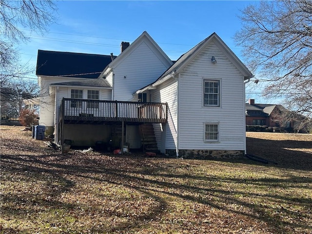 216 Hardee St, Dallas, GA 30132 - back of house featuring a wooden deck, a chimney, and a yard