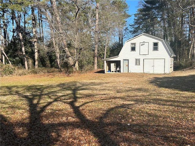 216 Hardee St, Dallas, GA 30132 - view of green lawn with an outdoor structure and a garage