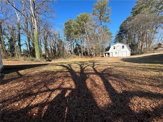 216 Hardee St, Dallas, GA 30132 - view of yard with a barn and an outbuilding