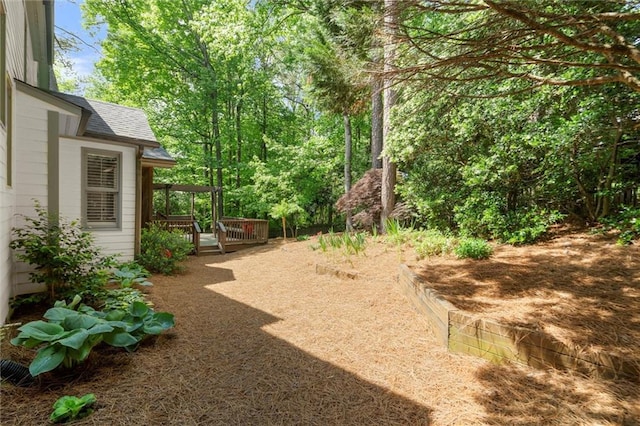 view of yard with a deck