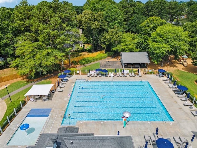 view of pool featuring fence