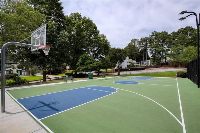view of sport court featuring fence and community basketball court