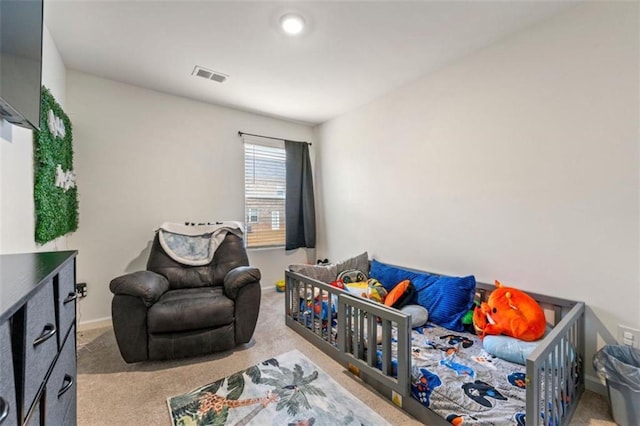 interior space featuring baseboards, visible vents, and light colored carpet