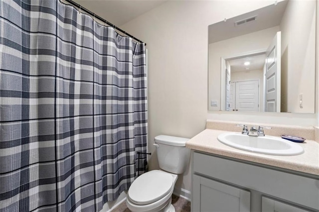 full bathroom with visible vents, vanity, and toilet