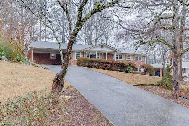 ranch-style home with a front lawn