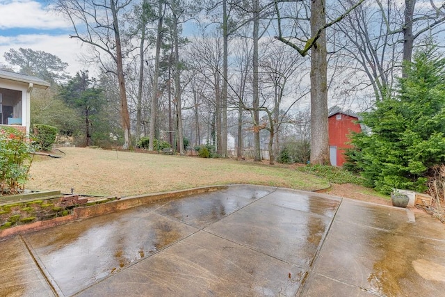 view of yard featuring a patio area and a shed