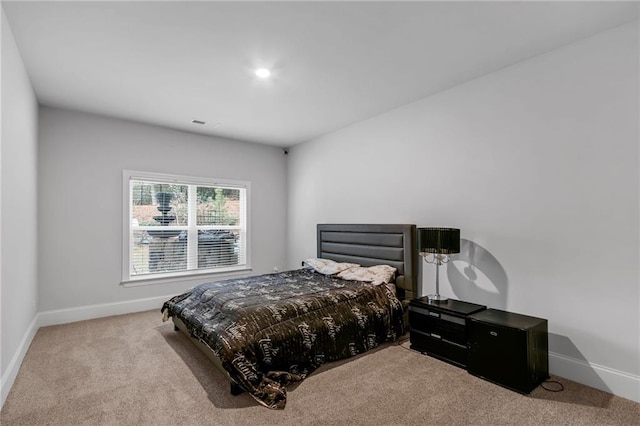 bedroom featuring baseboards and carpet flooring