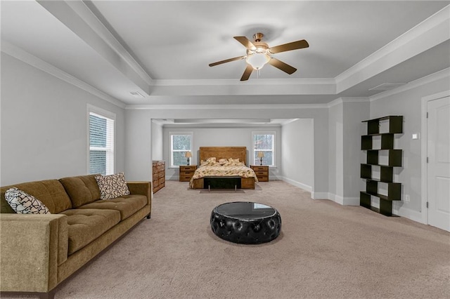 bedroom with baseboards, a tray ceiling, carpet flooring, and ornamental molding