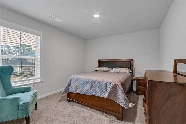 bedroom featuring carpet, visible vents, and baseboards