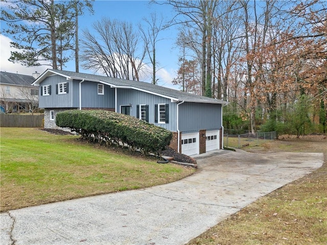 view of home's exterior with a yard and a garage