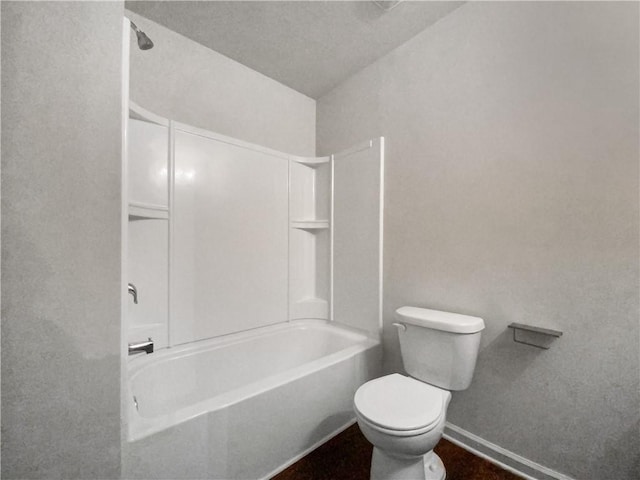 bathroom featuring  shower combination and toilet