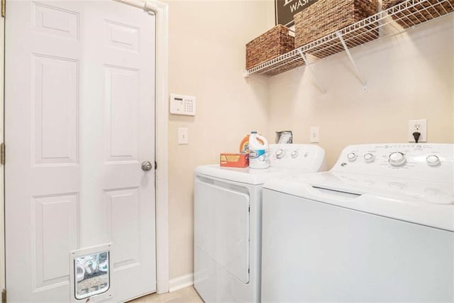 1856 Temple Park Dr, Loganville, GA 30052 - washroom with washing machine and clothes dryer and baseboards