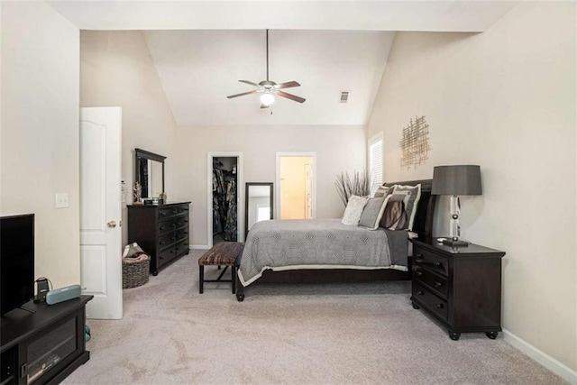 1856 Temple Park Dr, Loganville, GA 30052 - bedroom with light colored carpet, a walk in closet, a closet, high vaulted ceiling, and a ceiling fan