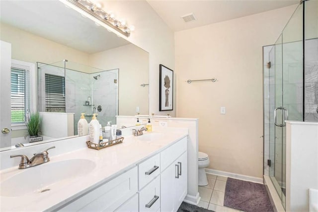 1856 Temple Park Dr, Loganville, GA 30052 - bathroom featuring double vanity, a shower stall, and tile patterned floors