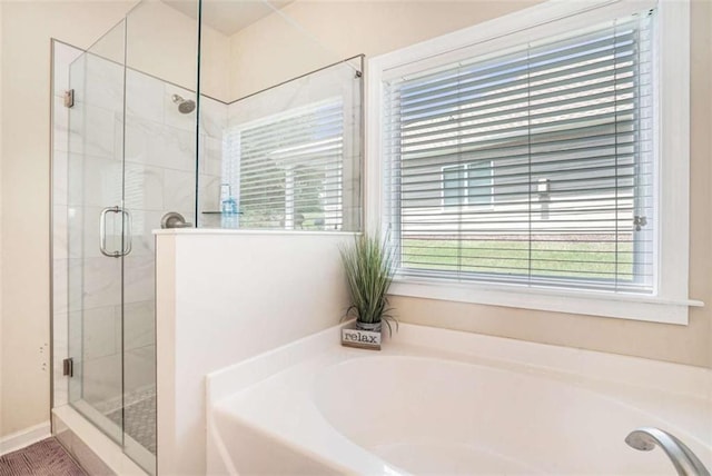 1856 Temple Park Dr, Loganville, GA 30052 - bathroom with a bath and a shower stall