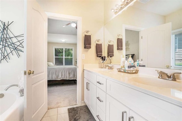 1856 Temple Park Dr, Loganville, GA 30052 - ensuite bathroom with double vanity, a bath, and tile patterned floors