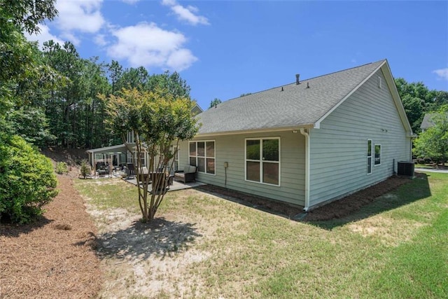 1856 Temple Park Dr, Loganville, GA 30052 - back of house featuring a lawn, a patio, and roof with shingles