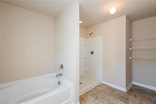 bathroom with separate shower and tub