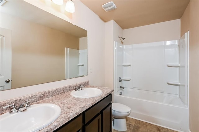 full bathroom featuring toilet, bathtub / shower combination, and vanity