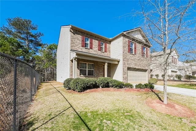 view of front of property featuring a front lawn and a garage