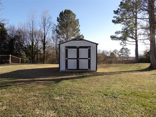 view of outbuilding with a lawn