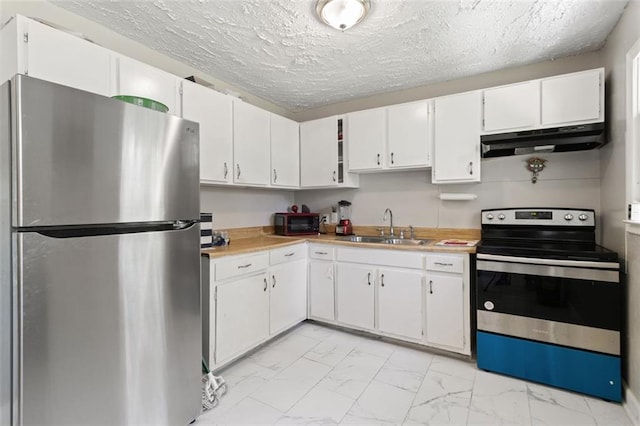 kitchen featuring sink, appliances with stainless steel finishes, and white cabinetry