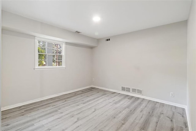 unfurnished room with light hardwood / wood-style flooring