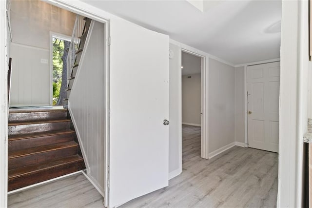 stairway with hardwood / wood-style floors