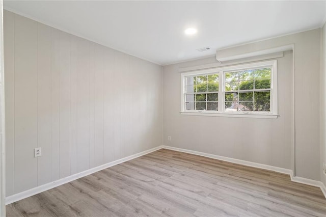 spare room with light wood-type flooring