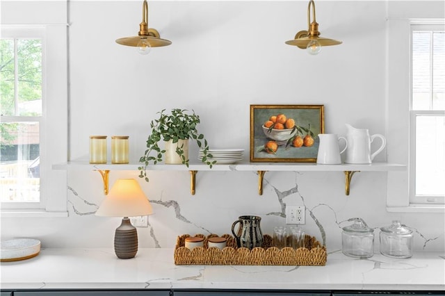 detailed view of open shelves and light stone countertops