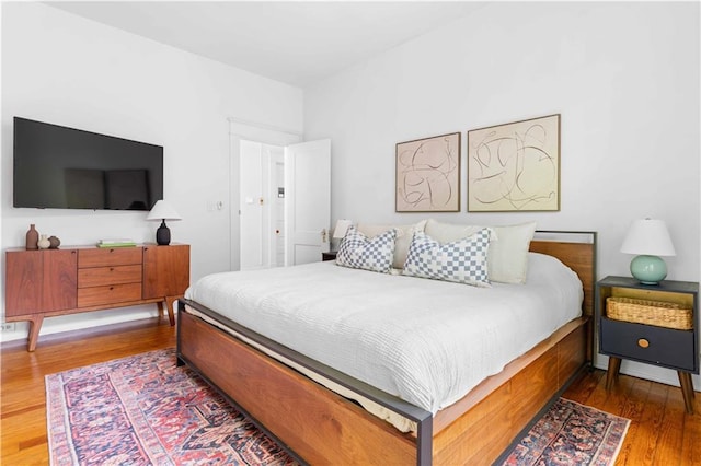 bedroom with wood finished floors