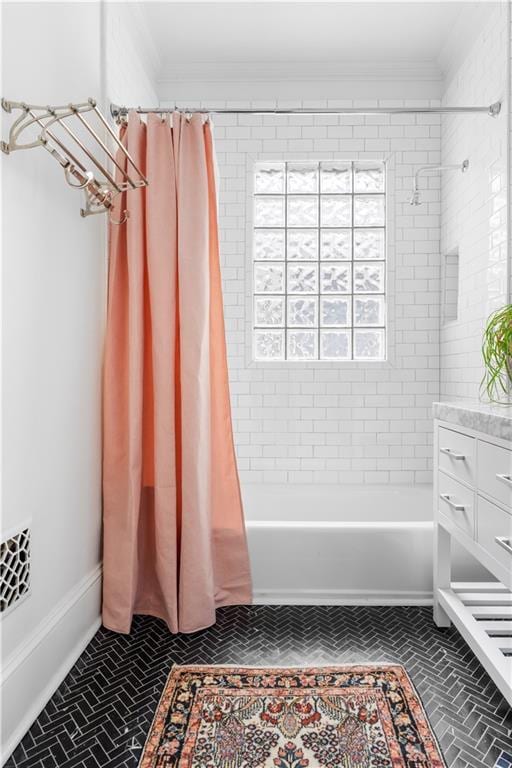 full bathroom with ornamental molding, shower / bath combination with curtain, and vanity