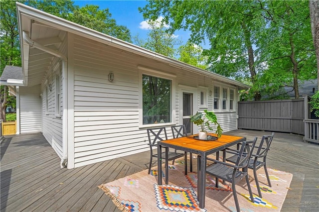 wooden terrace with outdoor dining space