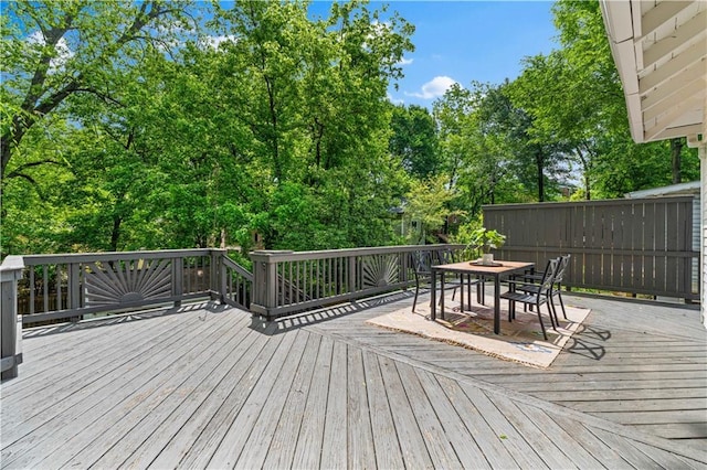 wooden deck with outdoor dining space