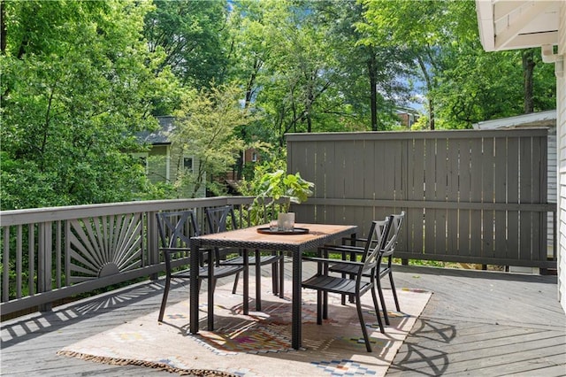 wooden deck featuring outdoor dining space