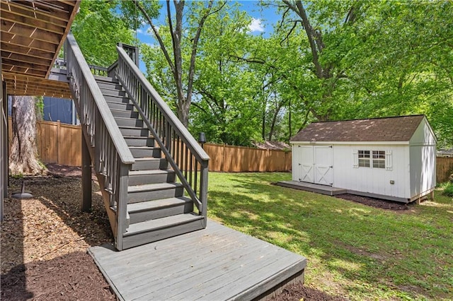 view of yard featuring stairway, a storage unit, an outdoor structure, and a deck