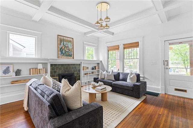 living room featuring coffered ceiling, hardwood / wood-style flooring, a fireplace, beamed ceiling, and baseboards