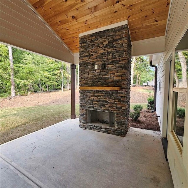 6093 Wayarer Dr, Villa Rica, GA 30180 - view of patio / terrace with an outdoor stone fireplace