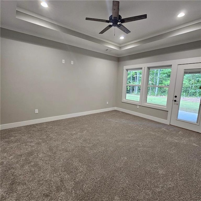 6093 Wayarer Dr, Villa Rica, GA 30180 - carpeted spare room with a tray ceiling, plenty of natural light, ceiling fan, baseboards, and recessed lighting